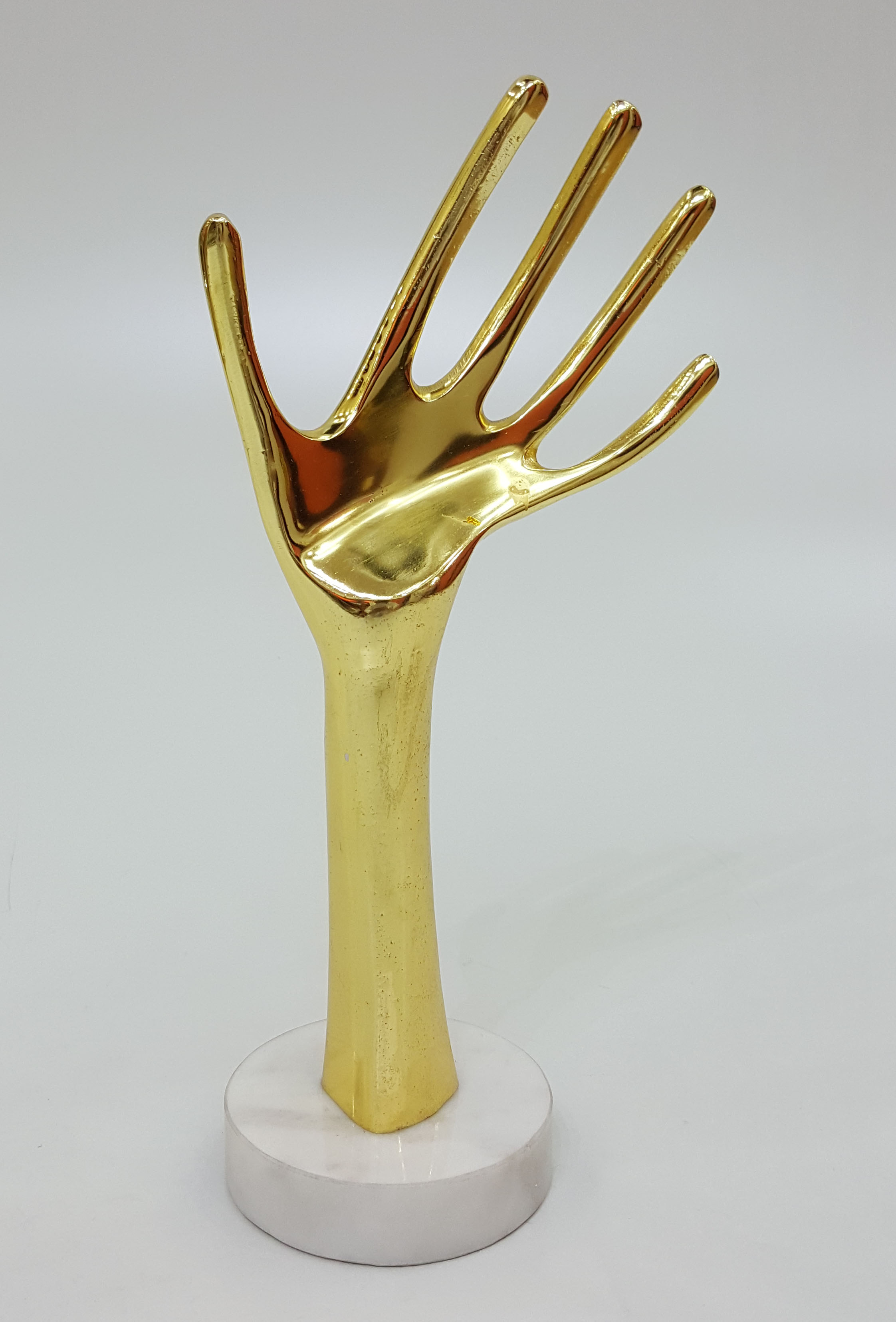 Gold Hand Sculpture on Marble